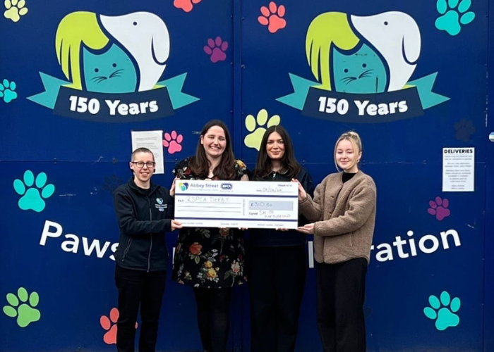 Pictured: Ella Davis, Nicole Saroglou and Sophie Shapcott presenting the cheque to Jamie Pritchard