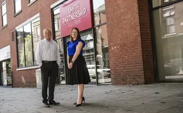 Pictured: Kevin McGrath with Sarah Reader, on Friar Gate in front of Smith Partnership’s head office