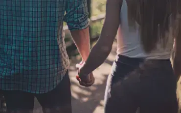 Couple holding hands