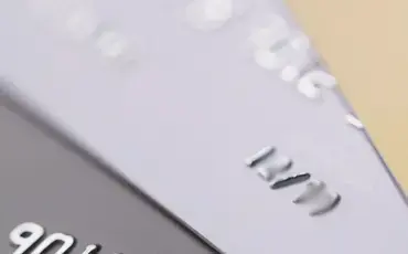 how much does a divorce cost article - picture of gold and silver credit cards