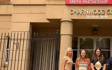 Della, Abbie, Erina, Michael and Enrika posing in front of Leicester office