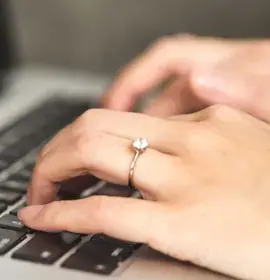 a-close-up-of-hands-typing-on-a-keyboard