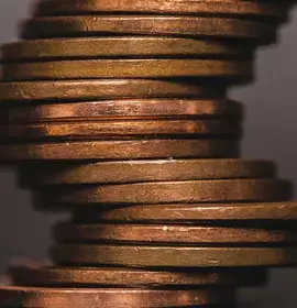 coins-stacked-in-crooked-pile