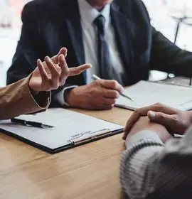 Person in Interview with CV on Table