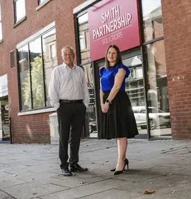 Pictured: Kevin McGrath with Sarah Reader, on Friar Gate in front of Smith Partnership’s head office