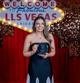 Emma holding her award