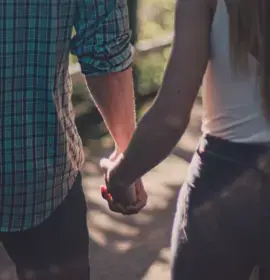 Couple holding hands