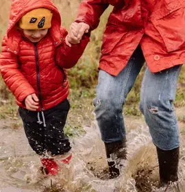 Child and Mum playing in mud