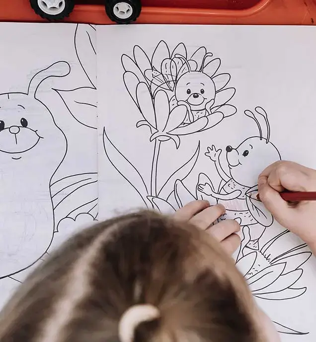 A girl colouring pictures