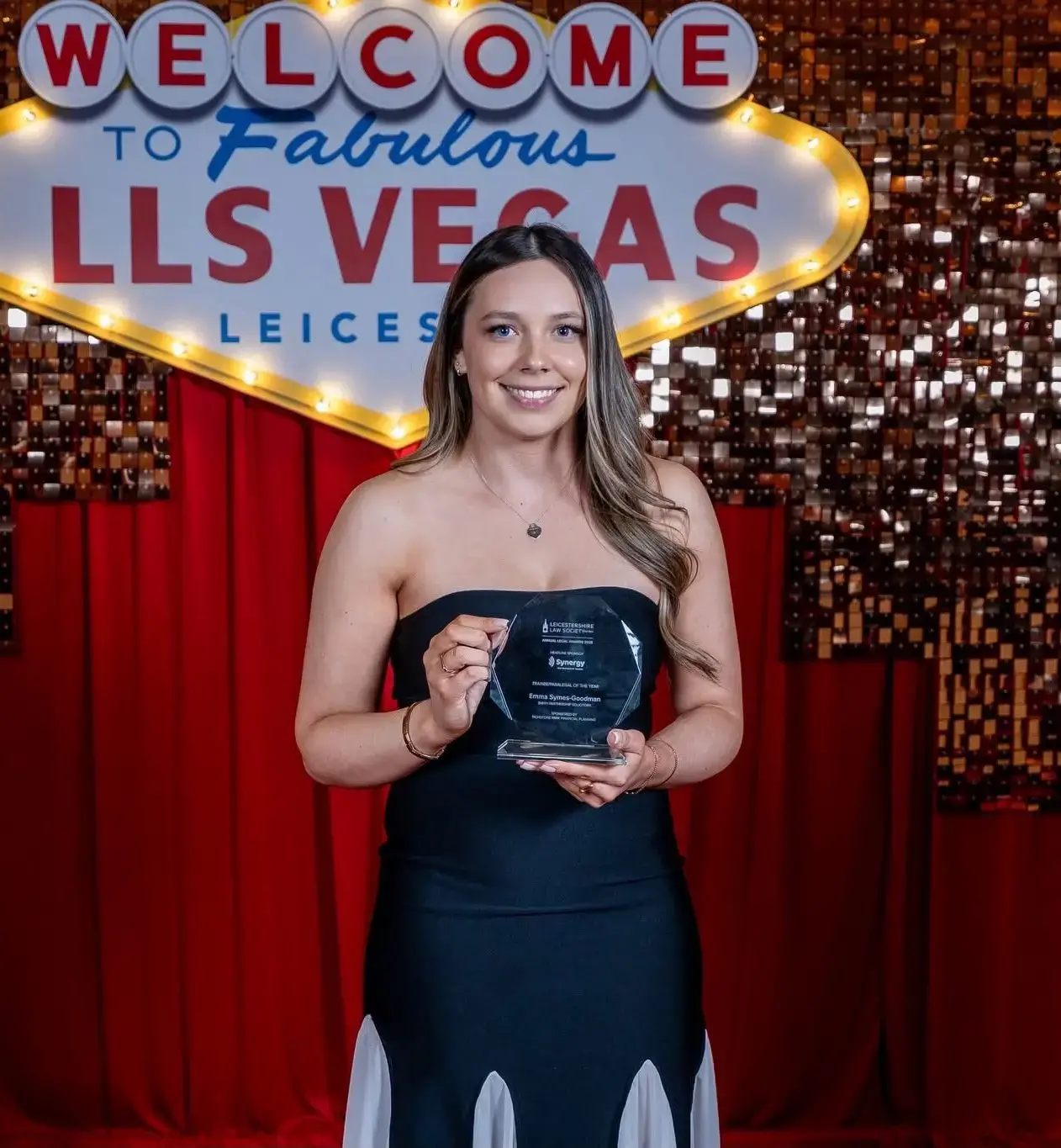 Emma holding her award