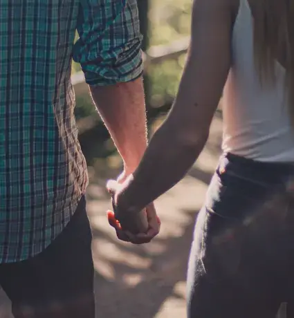 Couple holding hands