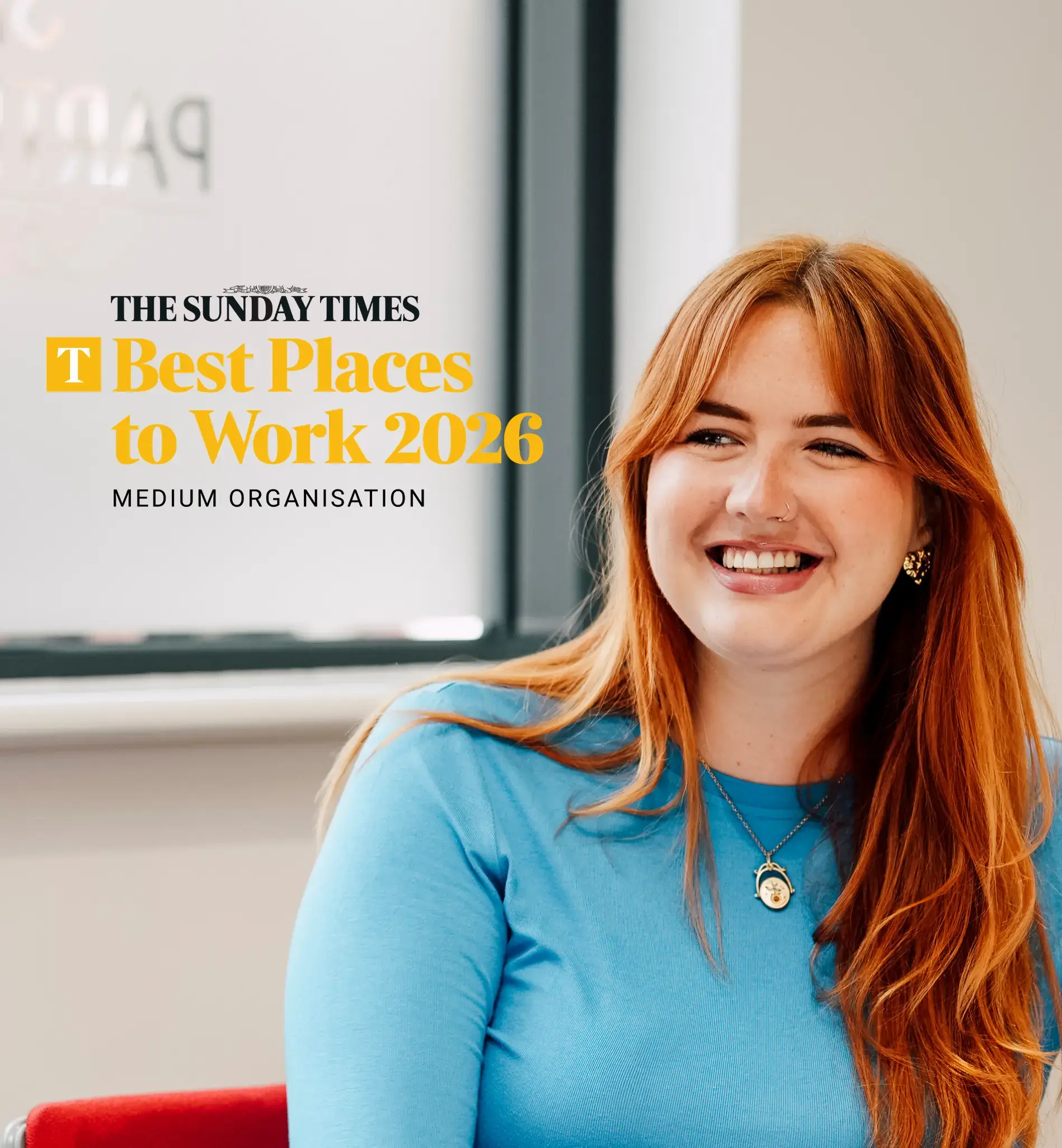HR team smiling with Sunday Times Logo