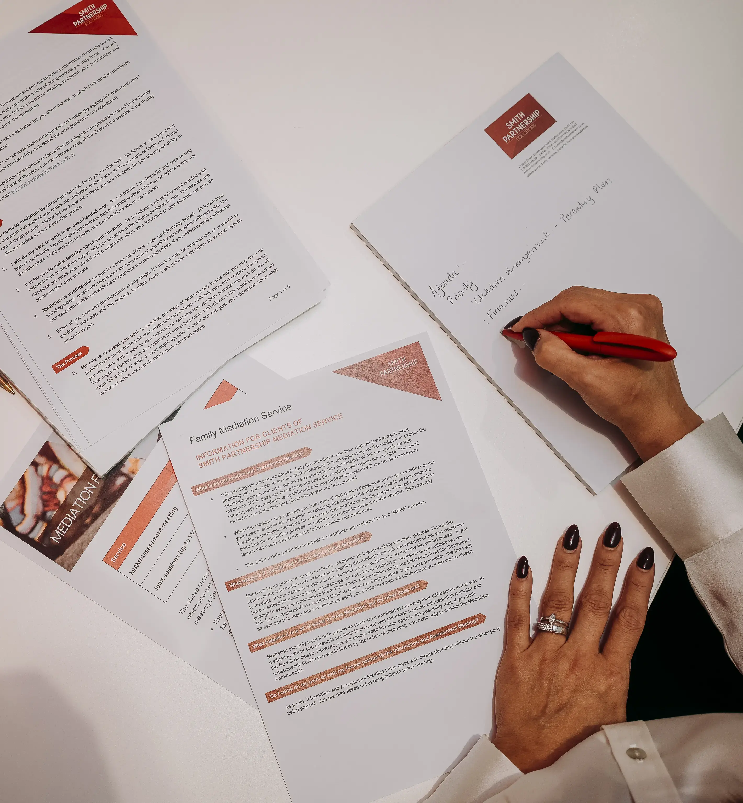 Mediator taking notes in a mediation session 
