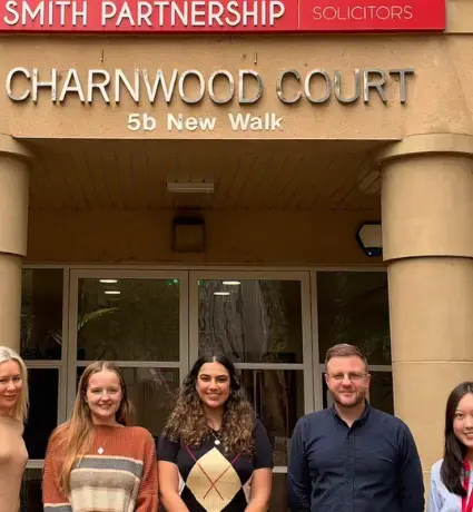 Della, Abbie, Erina, Michael and Enrika posing in front of Leicester office